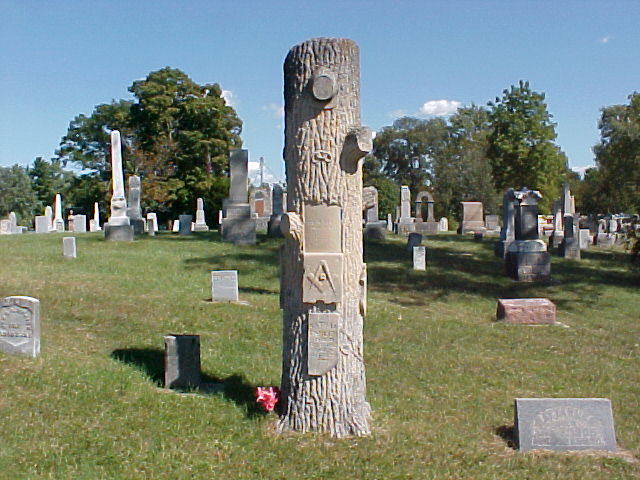 Nathan Fahler's monument is a tee - This usually marks the graves of Woodmen of the World members. Also, they usually contain other symbols such as anchors, lilies, vines, etc. Broken braches on the tree symbolize a life cut short.